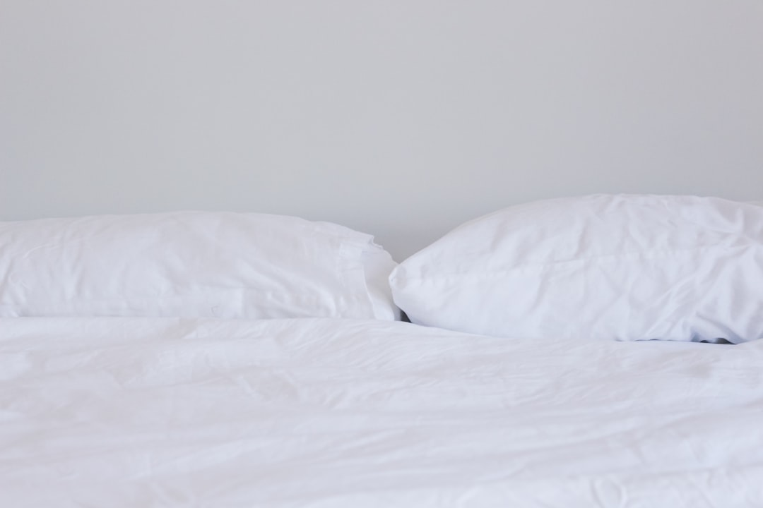 a bed with a lamp on it